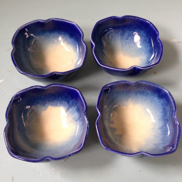 Set of bowls that are then dented on 4 sides to add interest